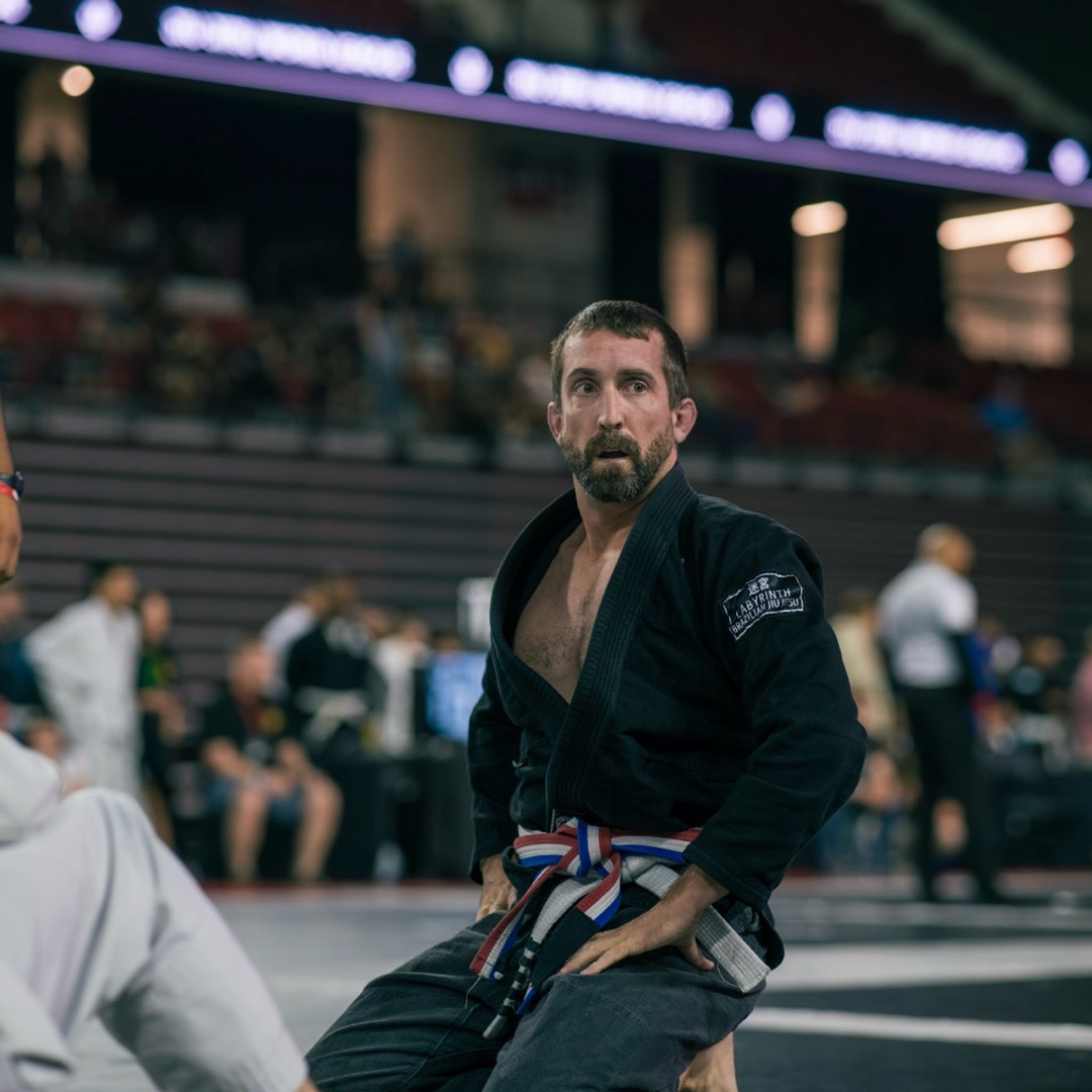 Adult BJJ competitor in black gi
